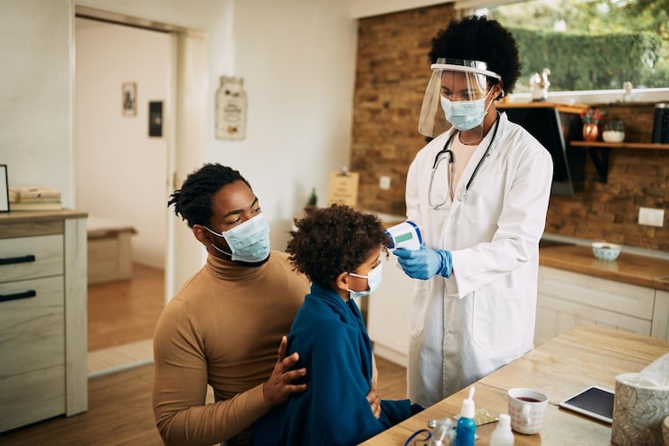 black-female-pediatrician-measuring-boy-s-temperature-home-visit-due-covid19-pandemic_637285-10511